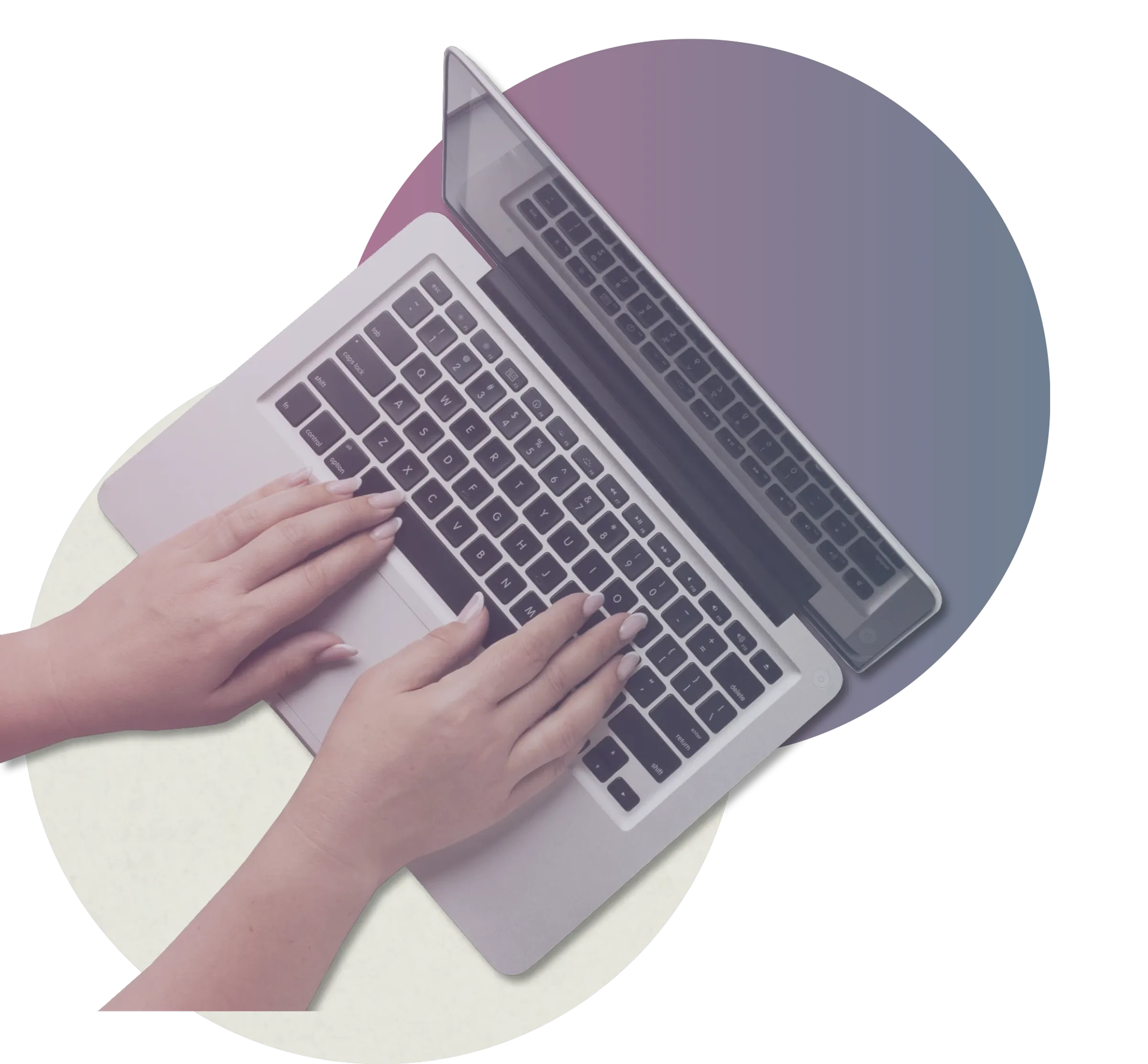 Hands on a laptop keyboard.