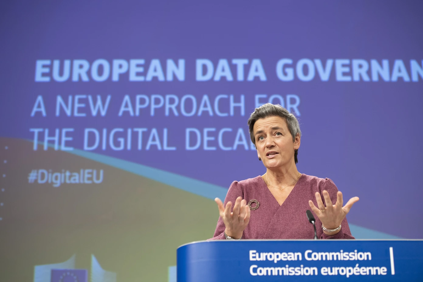 A person speaks at a podium at an event on European data governance.